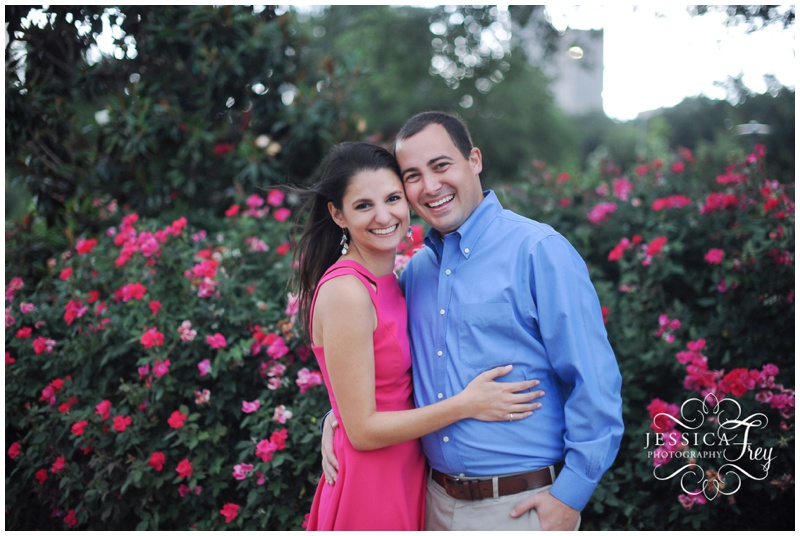 Spring Engagement Session with pink flowers in the background in Houston Texas