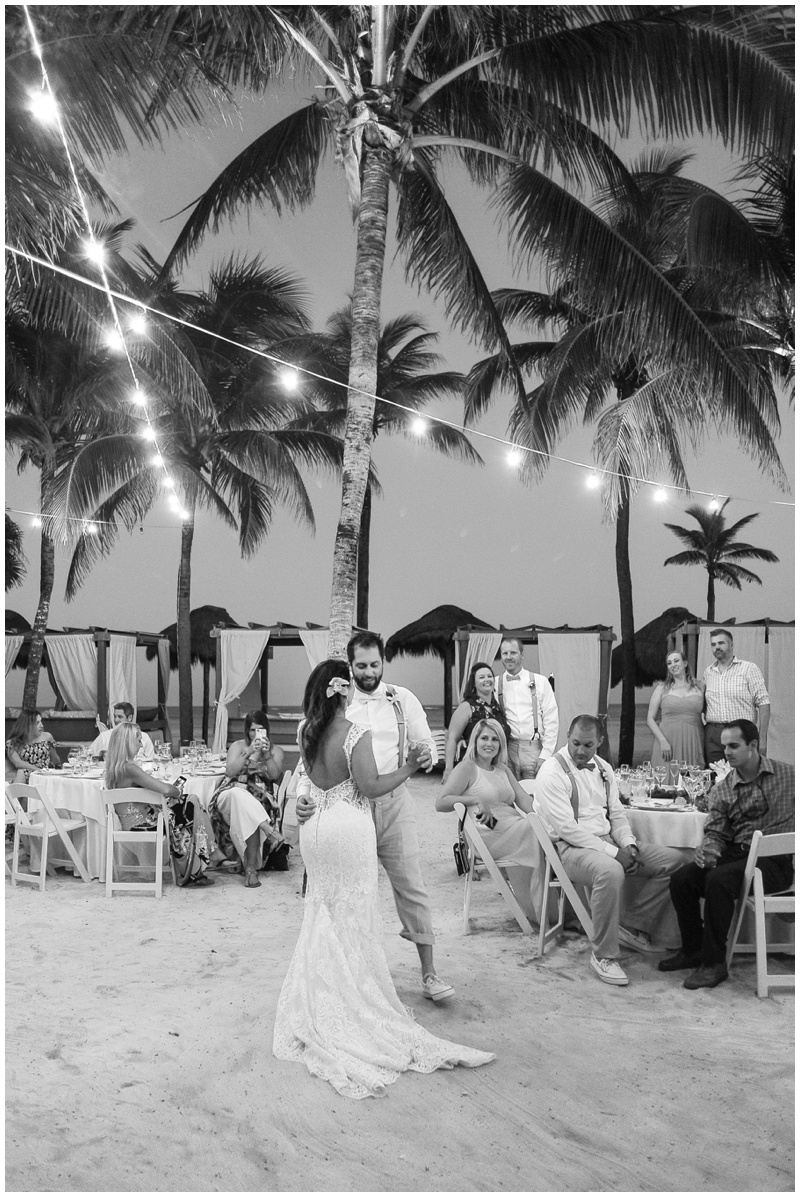 First dance as husband and wife under the palm trees of Dreams Tulum Resort and Spa