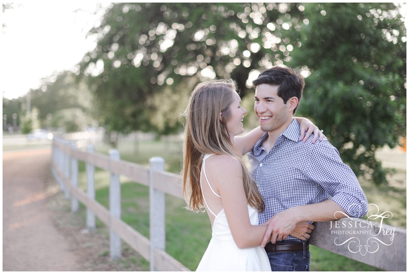 Engagement Photos with a white fence in Austin Texas