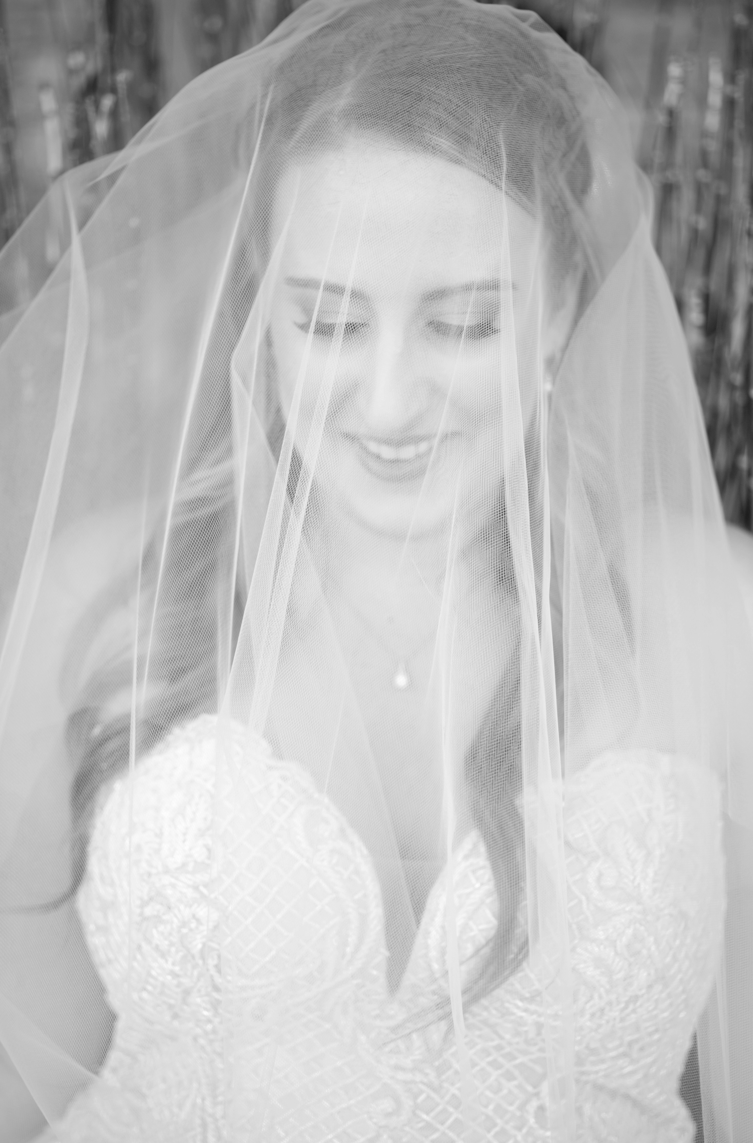 Bride laughs under the veil at Camp Lucy
