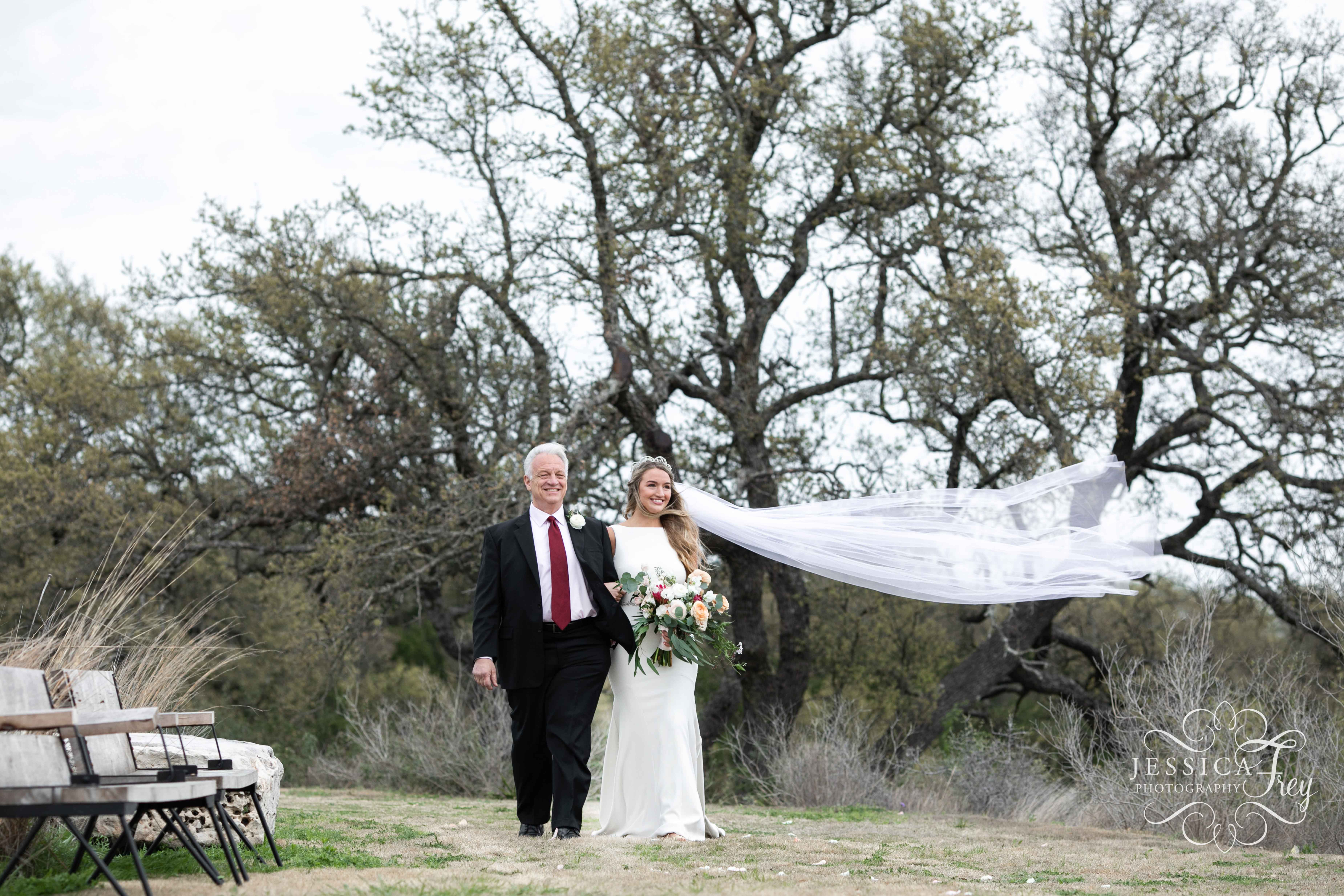 Bride's veil flies in the wind at Contigo Ranch Wedding
