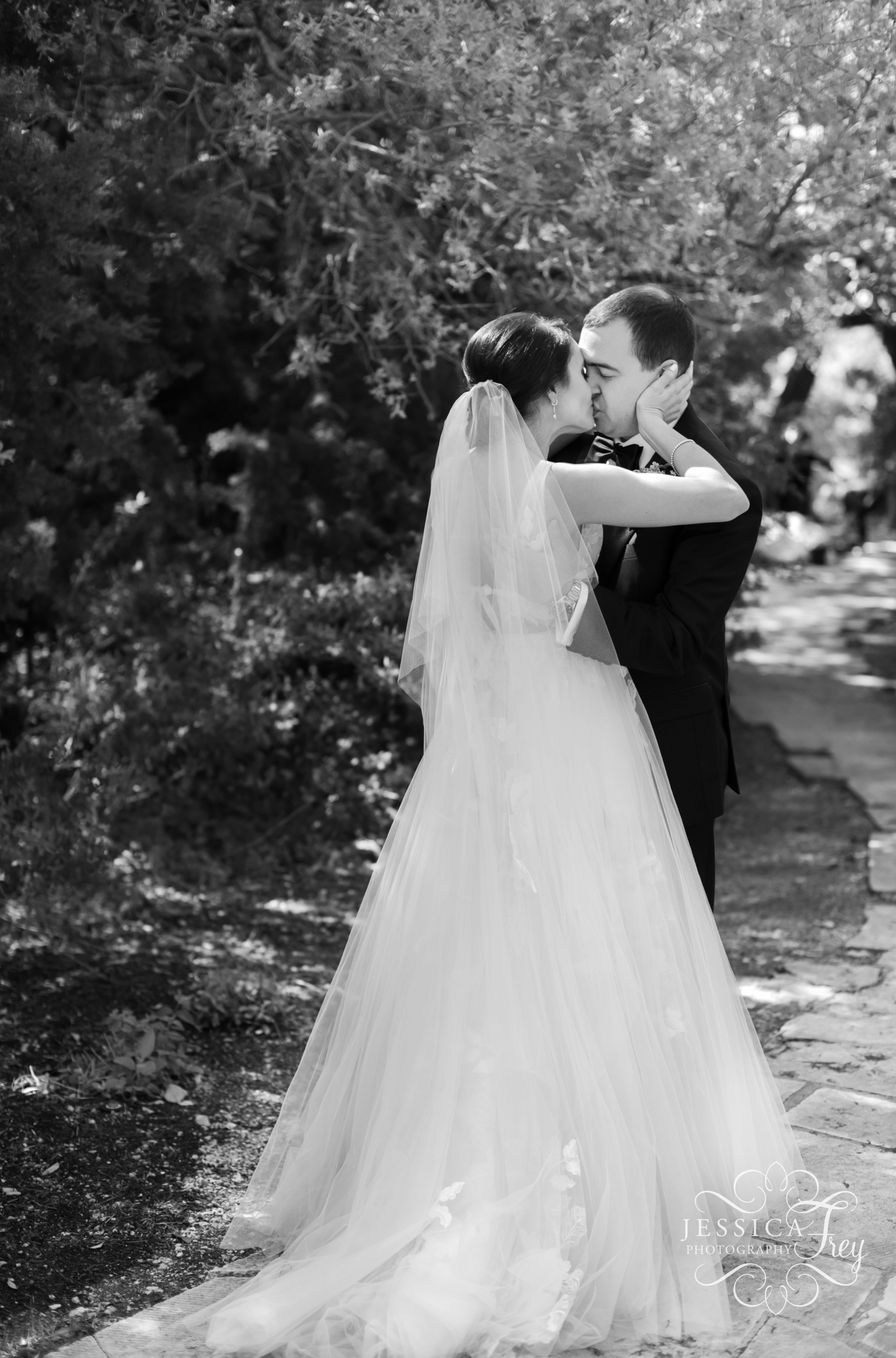 Bride and Groom share a kiss at Camp Lucy Wedding 