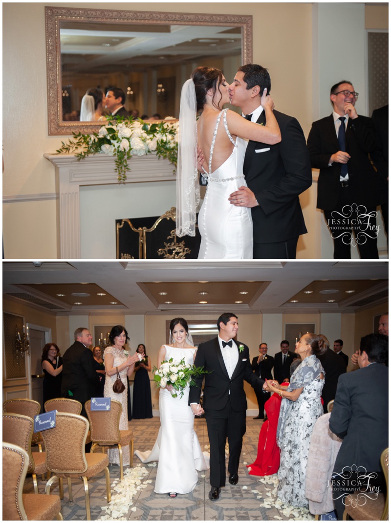 First Kiss as Husband and wife at indoor wedding ceremony at The Driskill Hotel in Downtown Austin